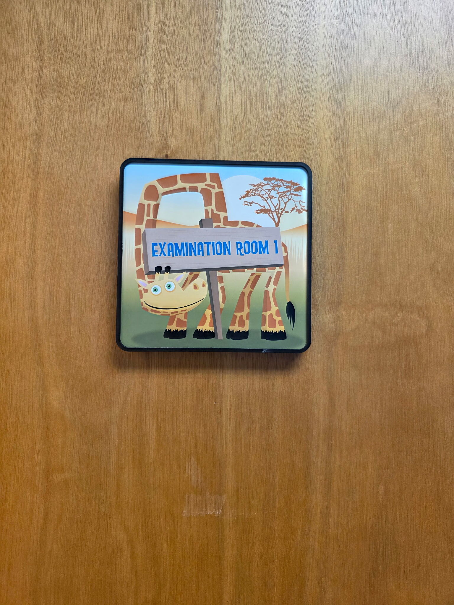 Examination Room 1 giraffe sign